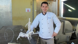 Manager/chef 'Monty' prepares a maquette for his pastry sculpture of Simpson and his donkey for ANZAC Day